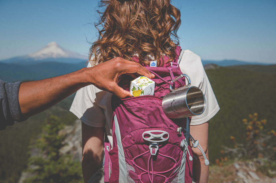 Pear Wyld Gummies in a hiker’s backpack. CBG Gummies may provide anti-anxiety effects.